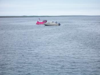 pink raft being rescued